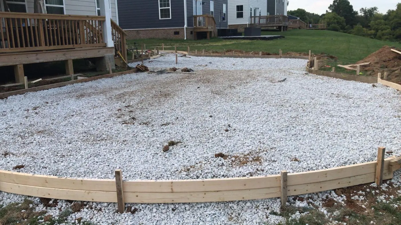 Compacted and graded base inside the forms before concrete is placed