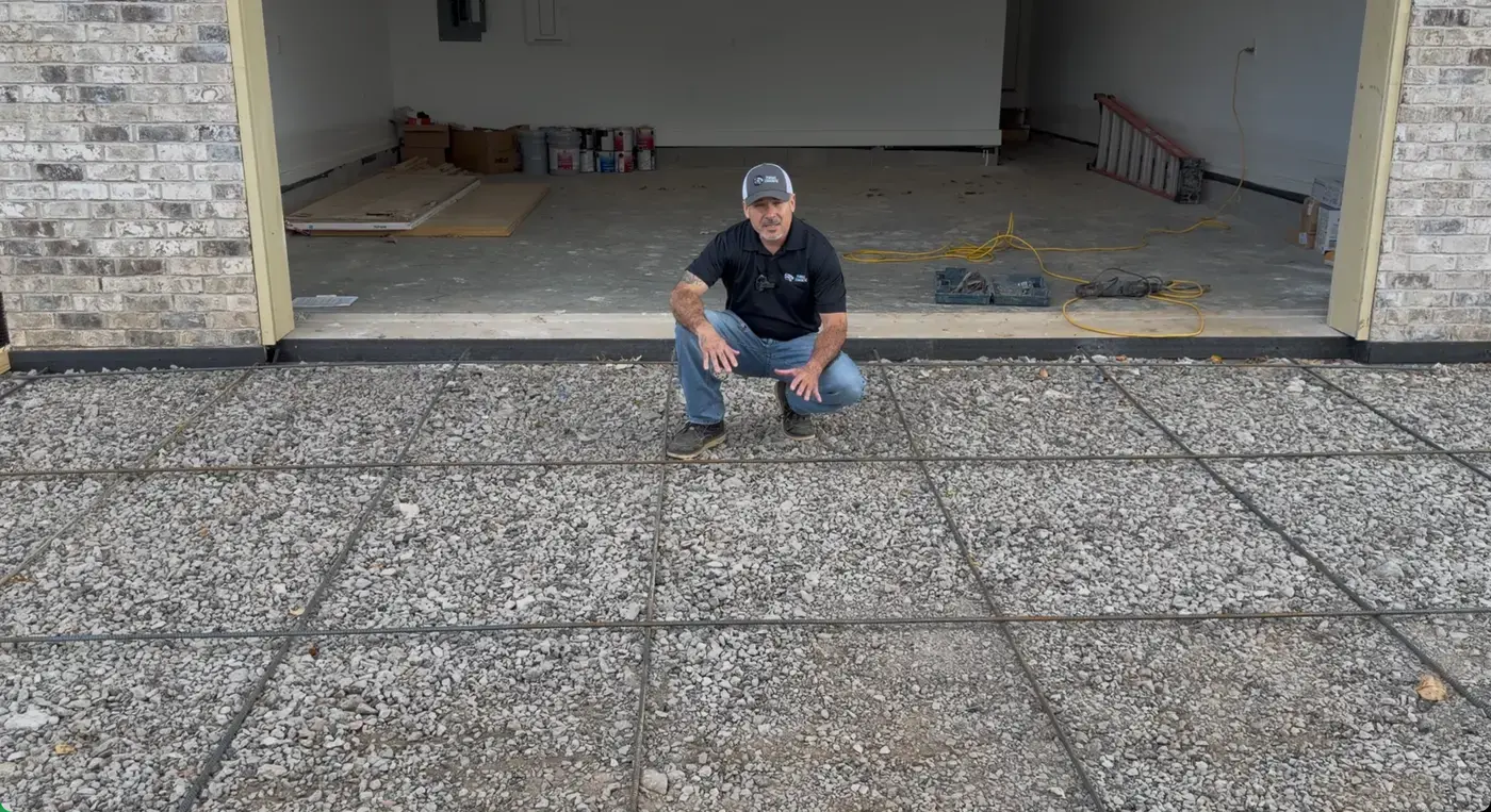 Cured slab with control joints cut at a garage opening